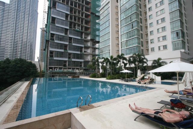 Swimming pool with sun loungers